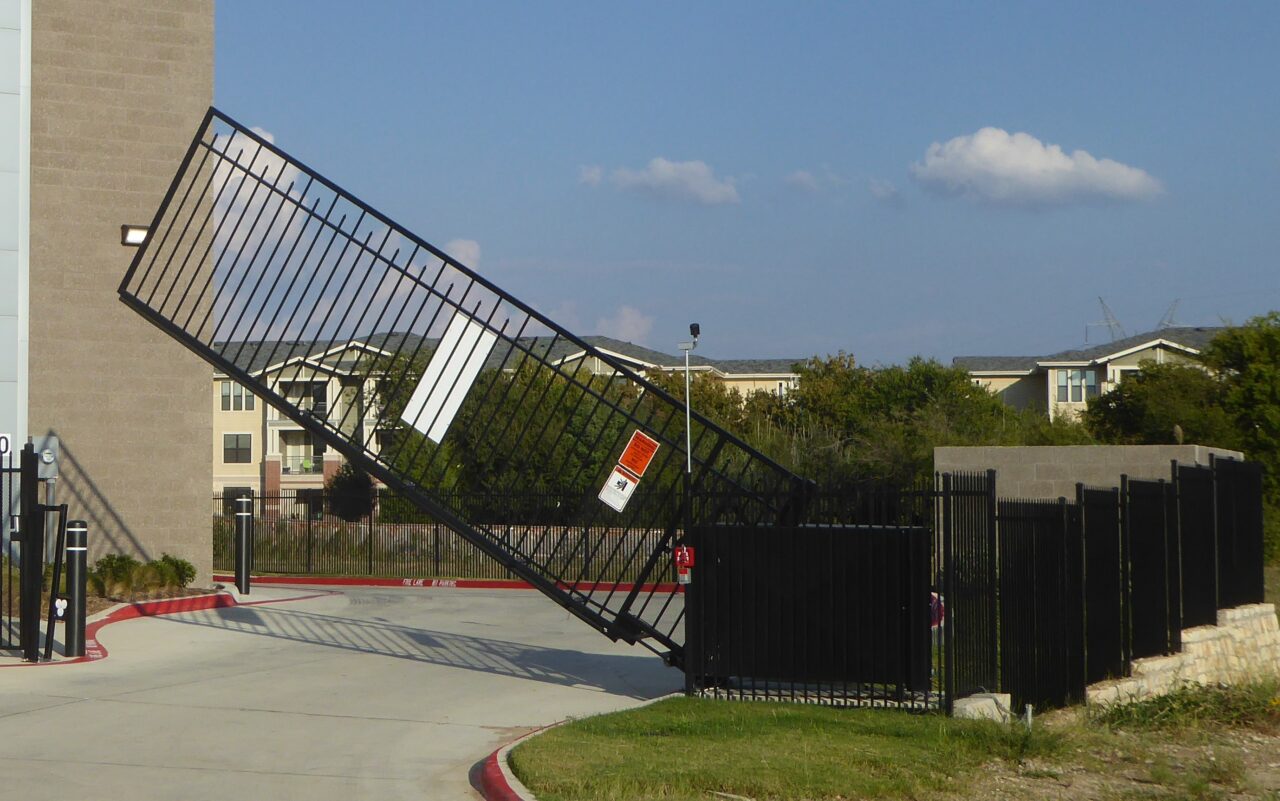 Open automated gate at a facility access point
