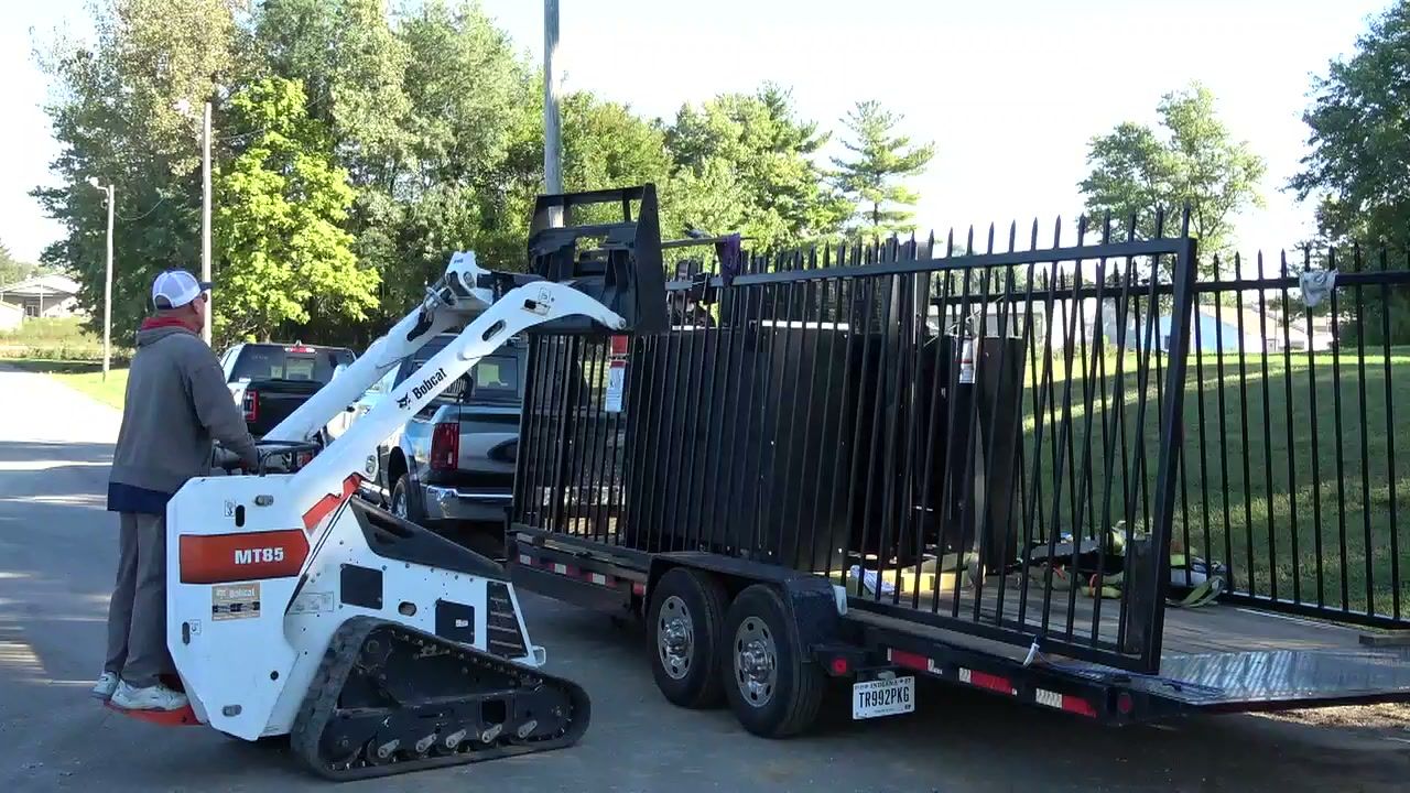 Unloading the gate panel from the trailer