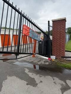Technician working on gate repair with tools