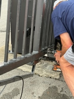 New hardware installed on repaired gate