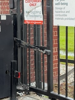 Gate operator arm secured and functioning