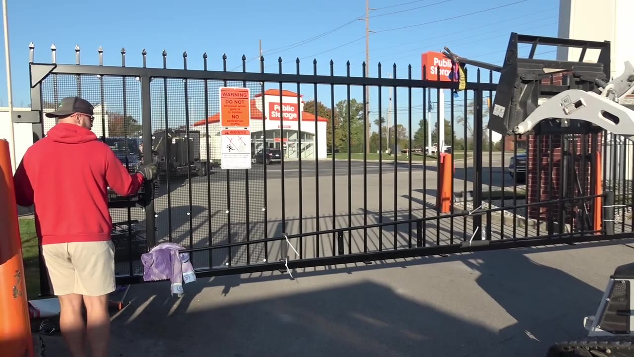 SMS crew hanging and aligning the gate panel