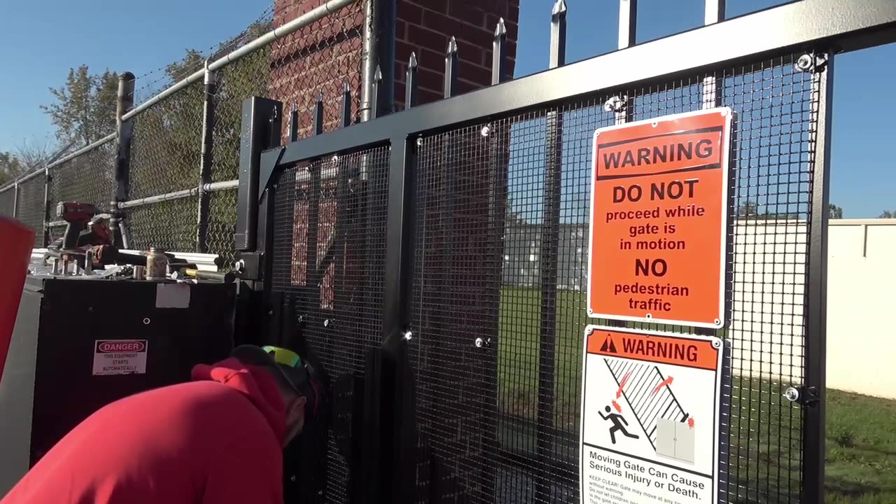 Mesh gate panel with pedestrian warning signage