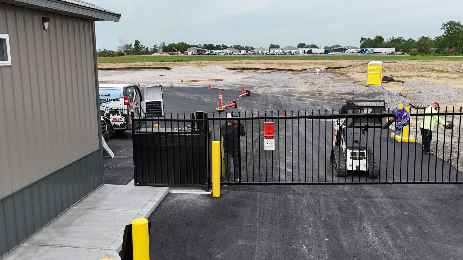 Completed vertical pivot gate installation at a self-storage facility