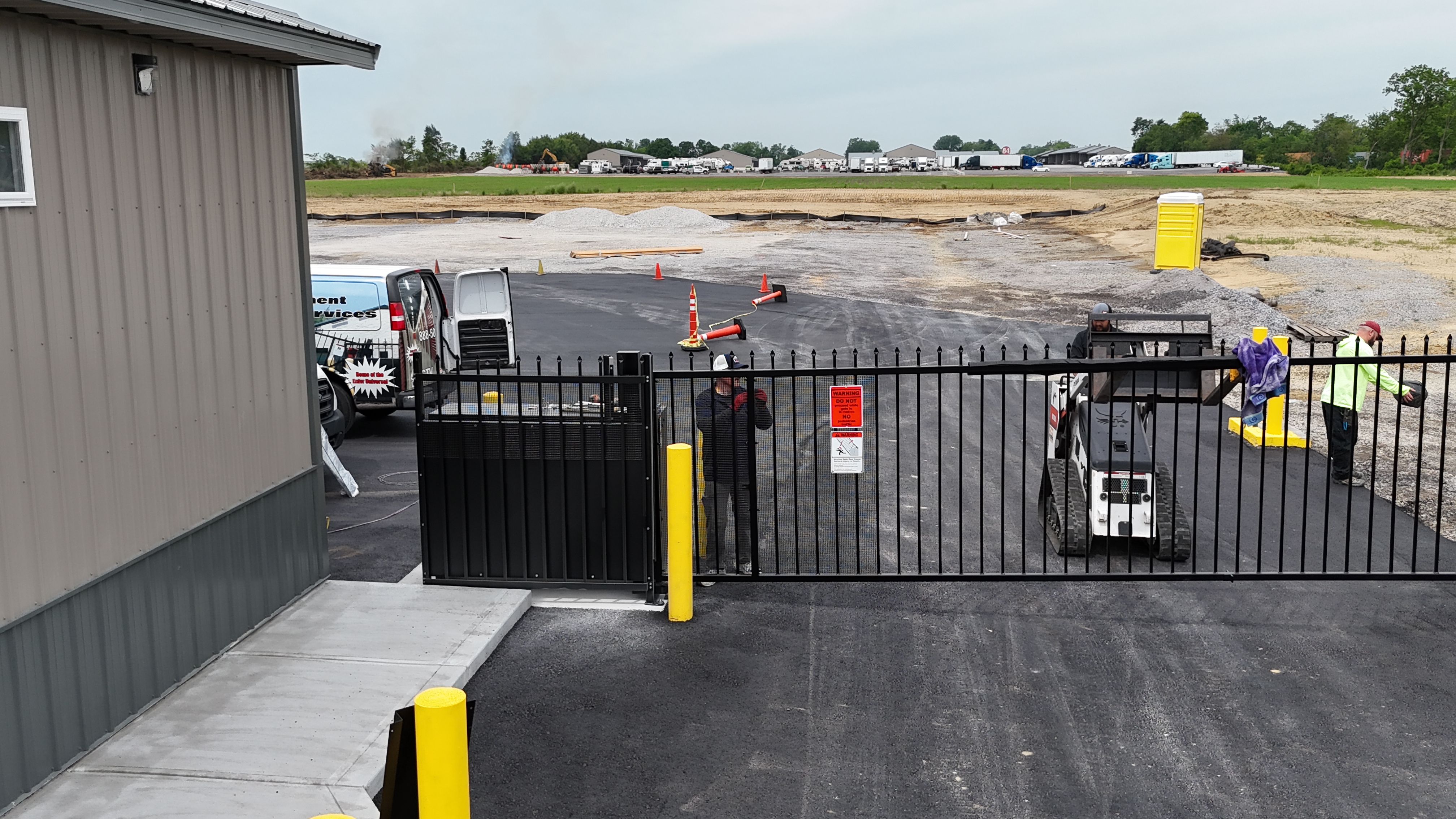 Completed vertical pivot gate installation with finished drive lane