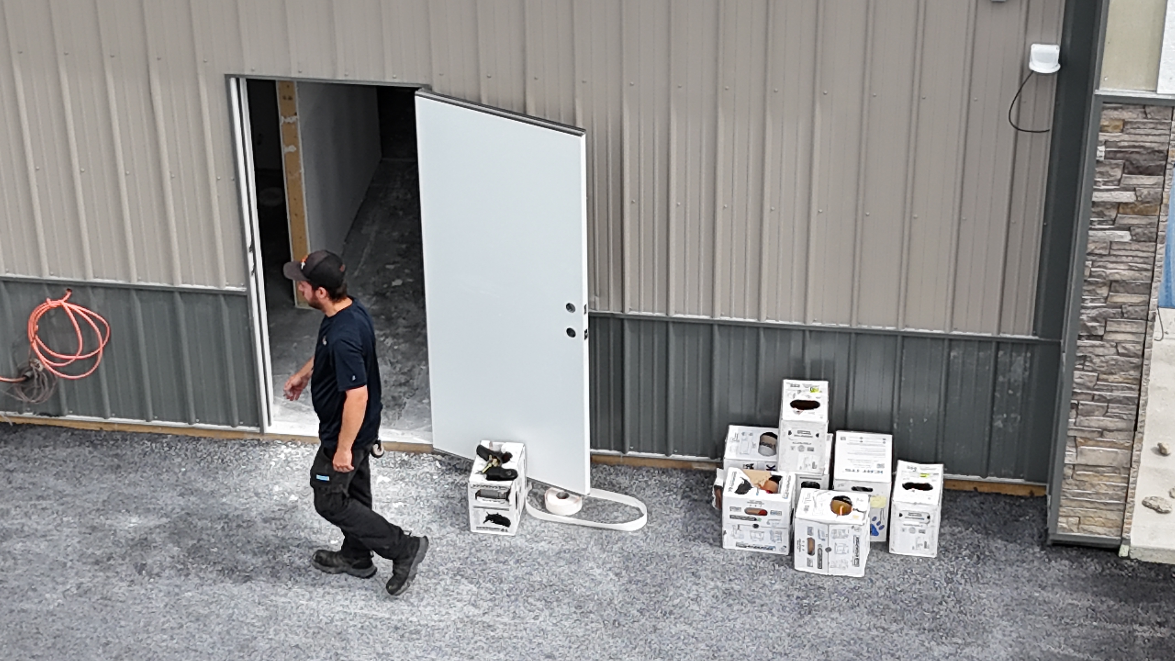 Vertical pivot gate components staged on a trailer